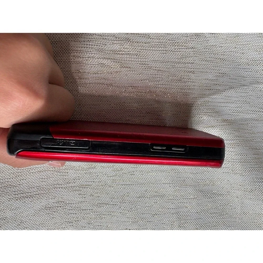 red Samsung SGH-A777, a 3G slider phone